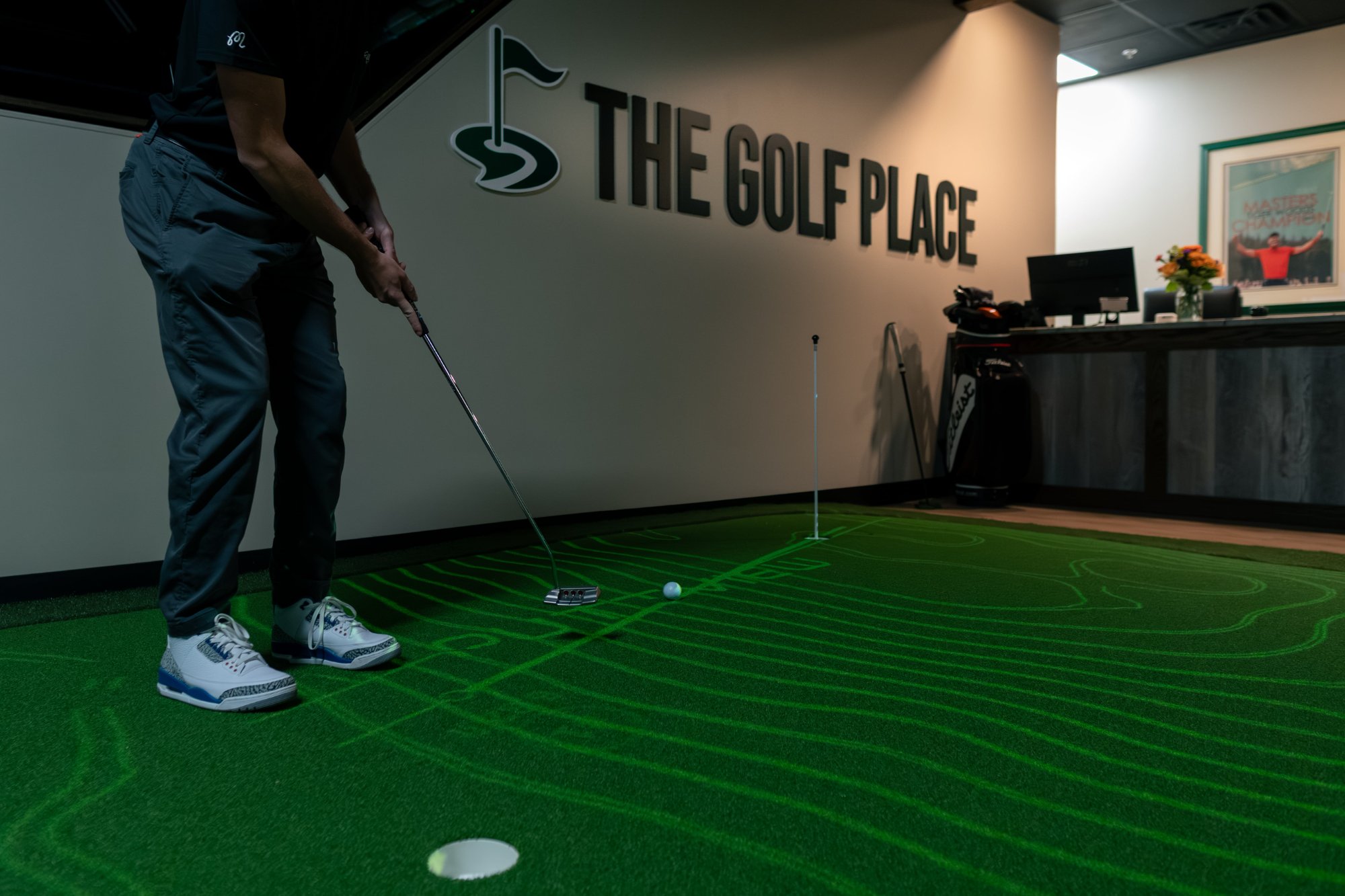 The Golf Place lobby with PuttView putting green